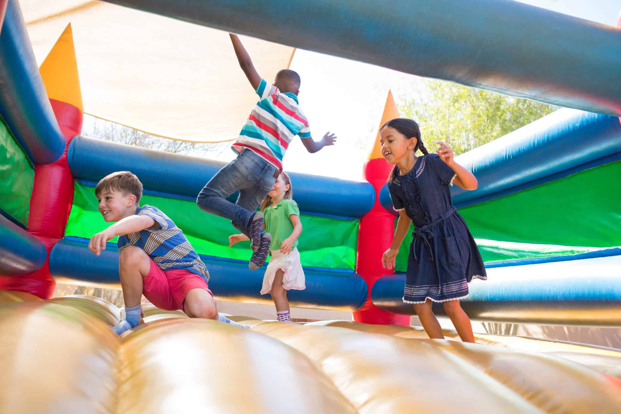 Children having fun on a bouncy castle